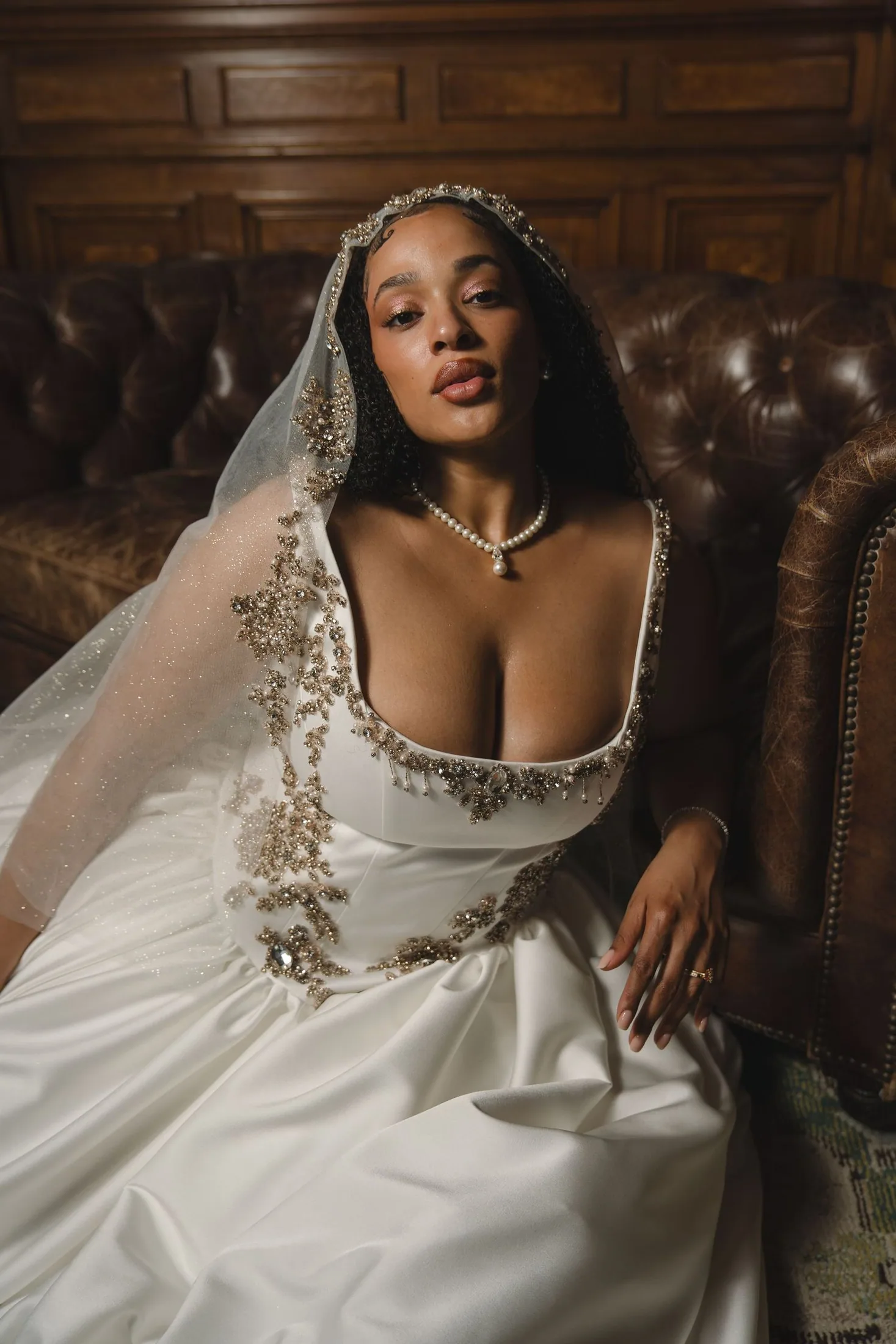 Editorial bridal portrait in a wood-paneled room